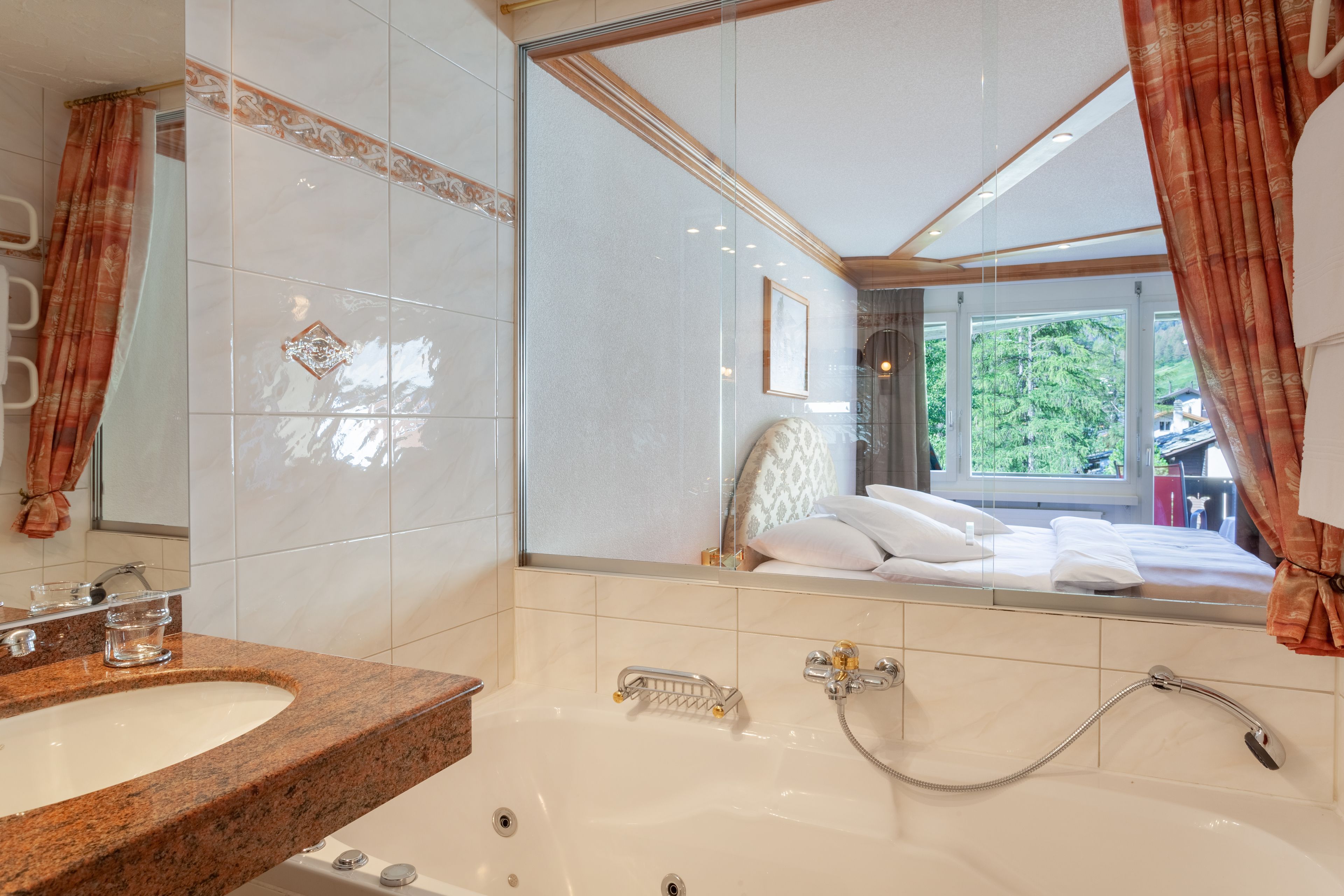 suite, jetted tub, mountain view | minibar, in-room safe, desk, cots/infant beds