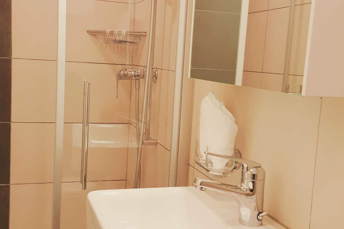 superior triple room | bathroom | shower, free toiletries, hair dryer, towels