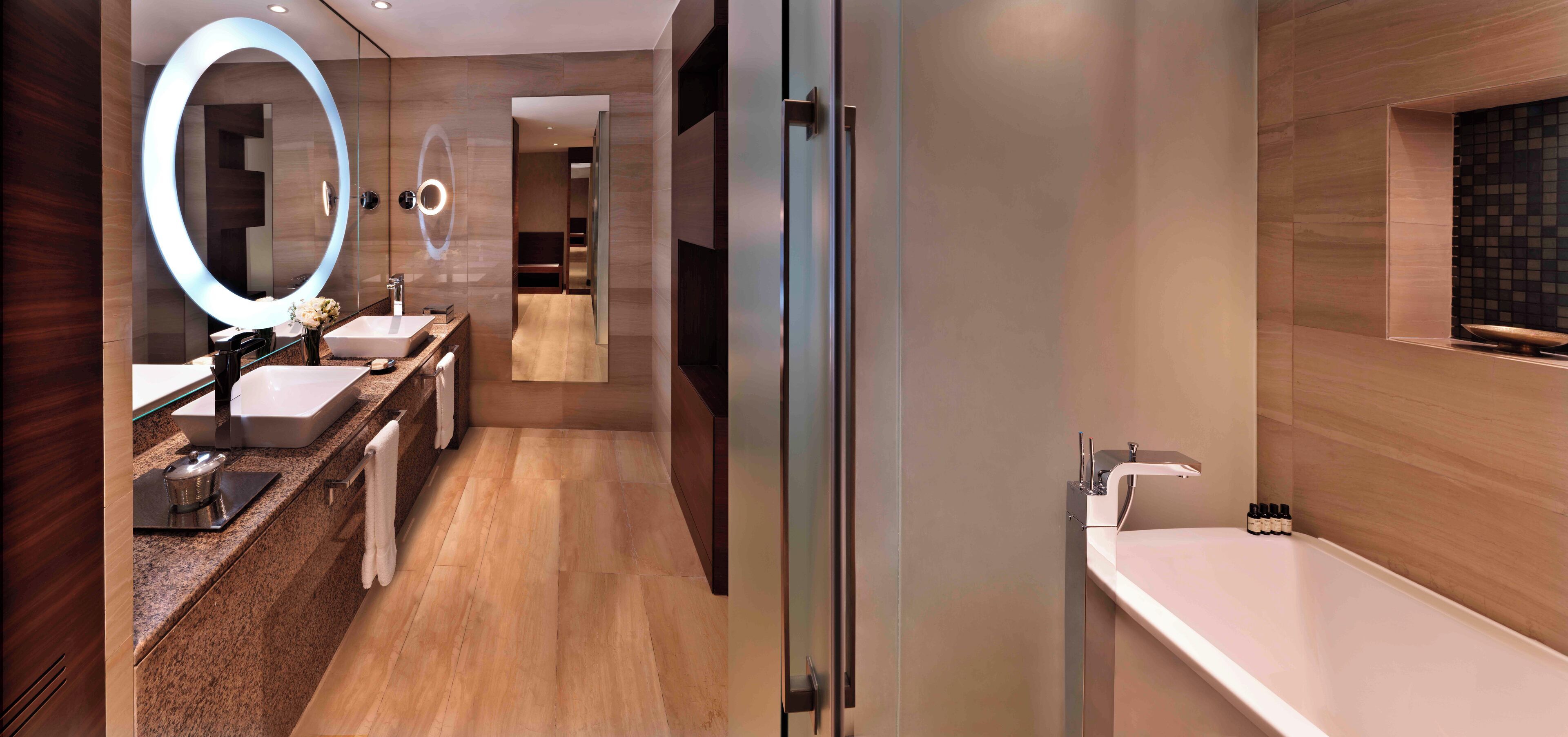 combined shower/bathtub, designer toiletries, hair dryer, bathrobes