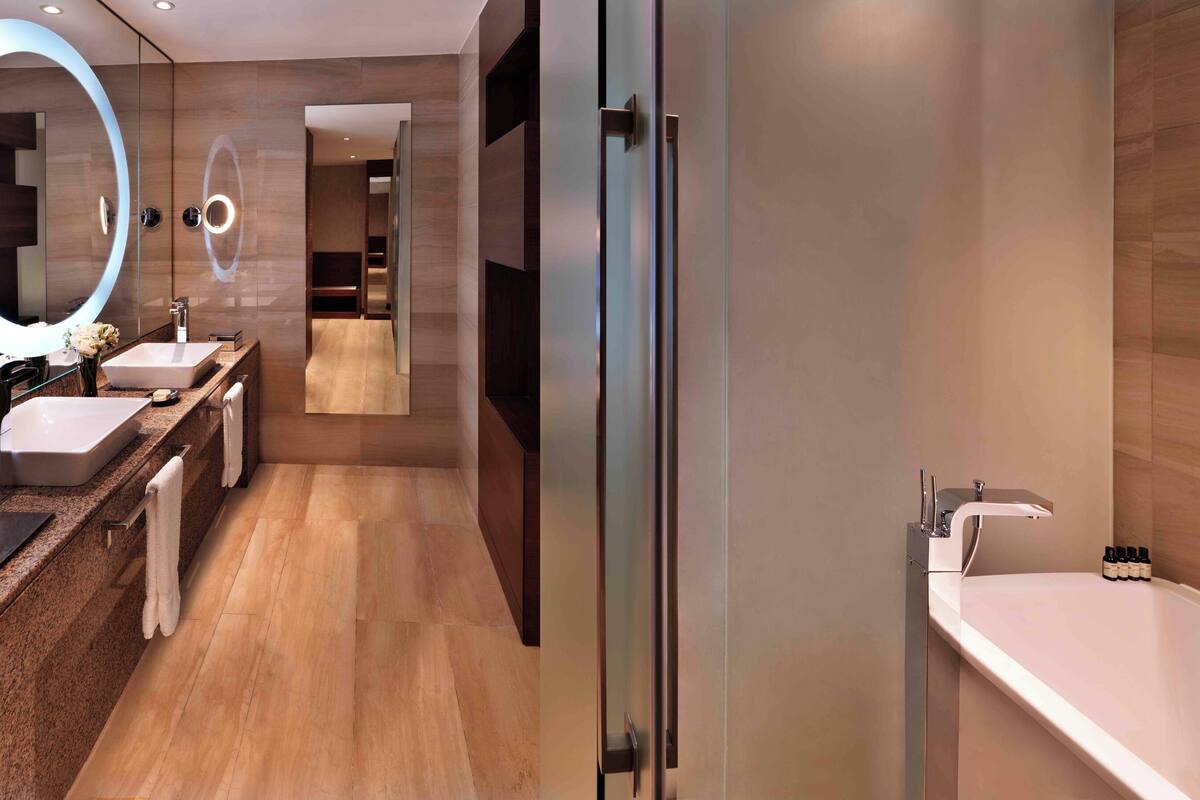 combined shower/bathtub, designer toiletries, hair dryer, bathrobes