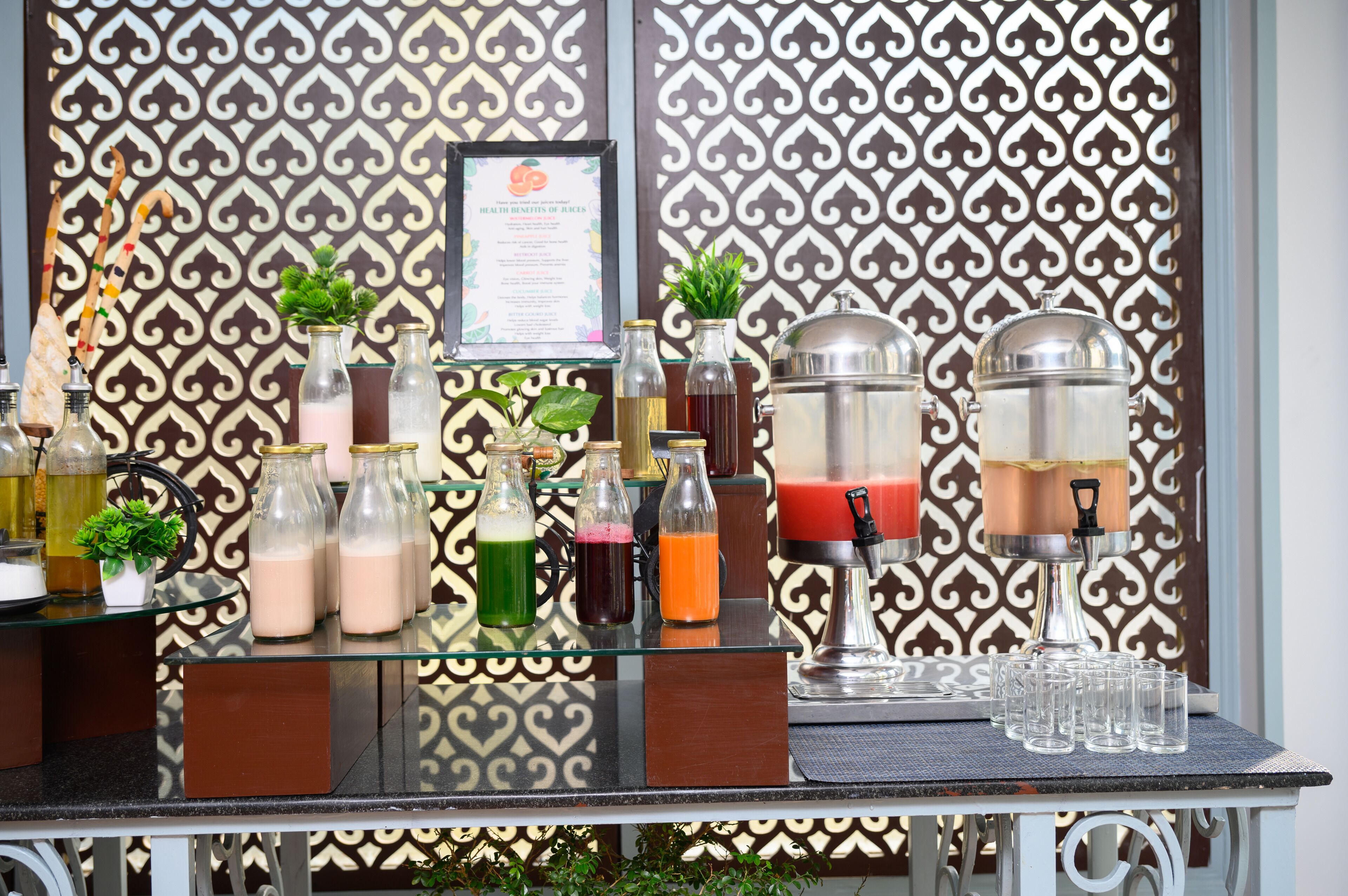 A bar area with a variety of drinks and a menu board.