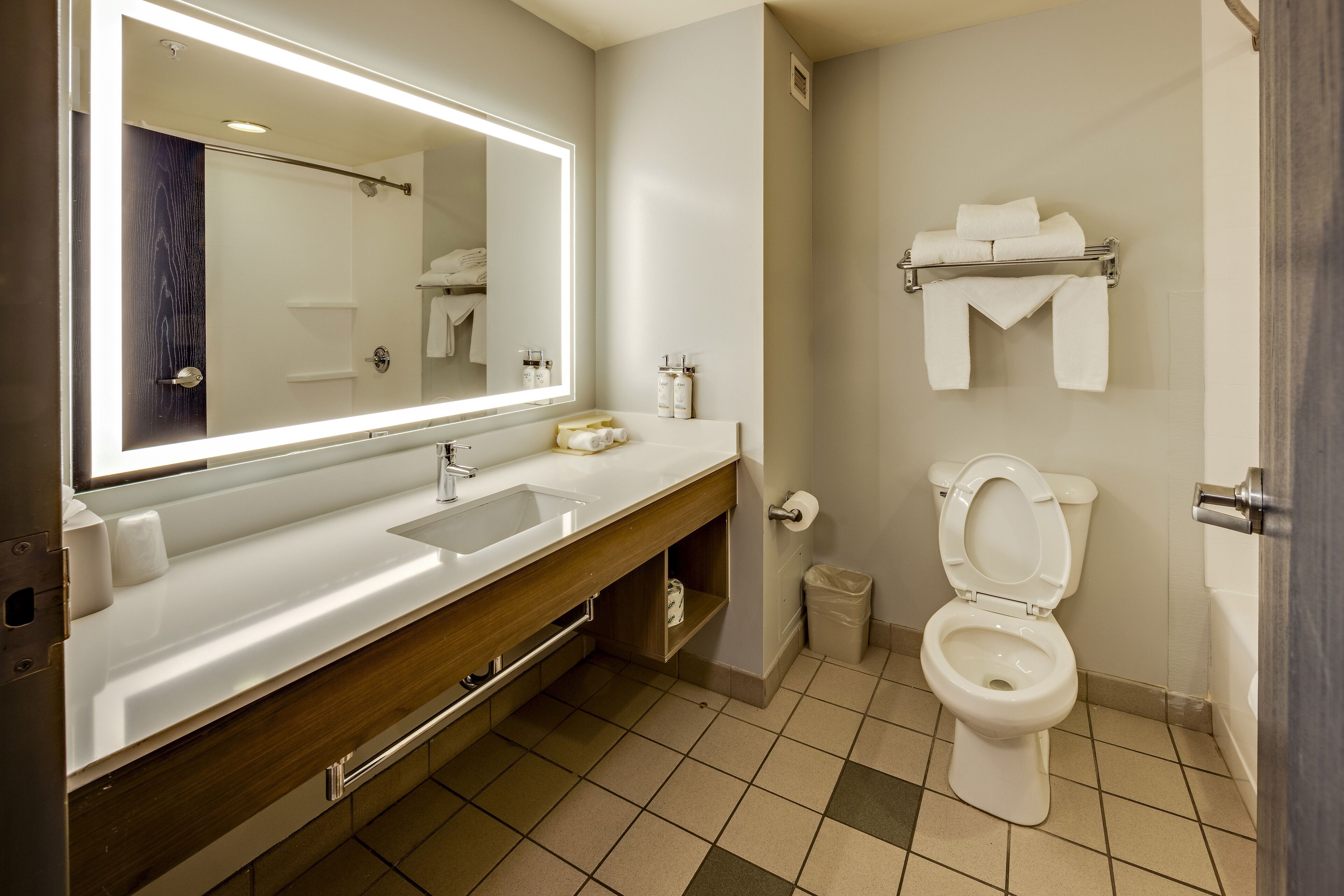 designer toiletries, hair dryer, towels, soap