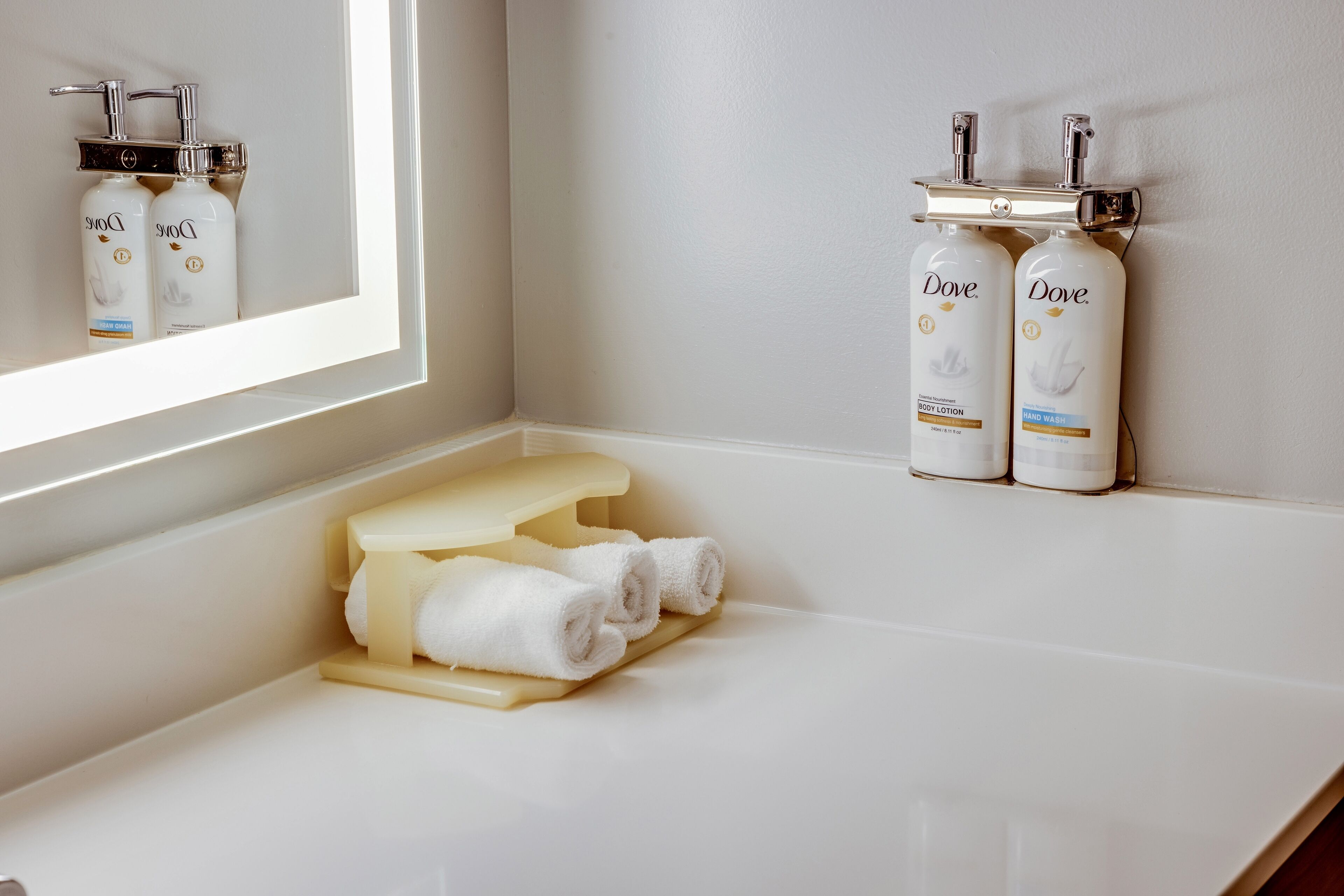 designer toiletries, hair dryer, towels, soap