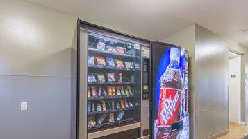A vending machine with snacks and a beverage dispenser.