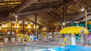 An indoor water park with a pool, slides, and inflatable rings. - Residence Inn by Marriott, North Conway (North Conway)