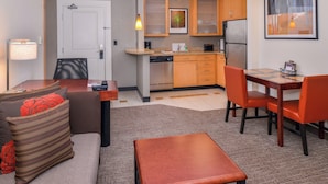 A compact living space with a kitchenette, a dining area, and a seating area with a sofa and chairs. - Residence Inn by Marriott, North Conway (North Conway)