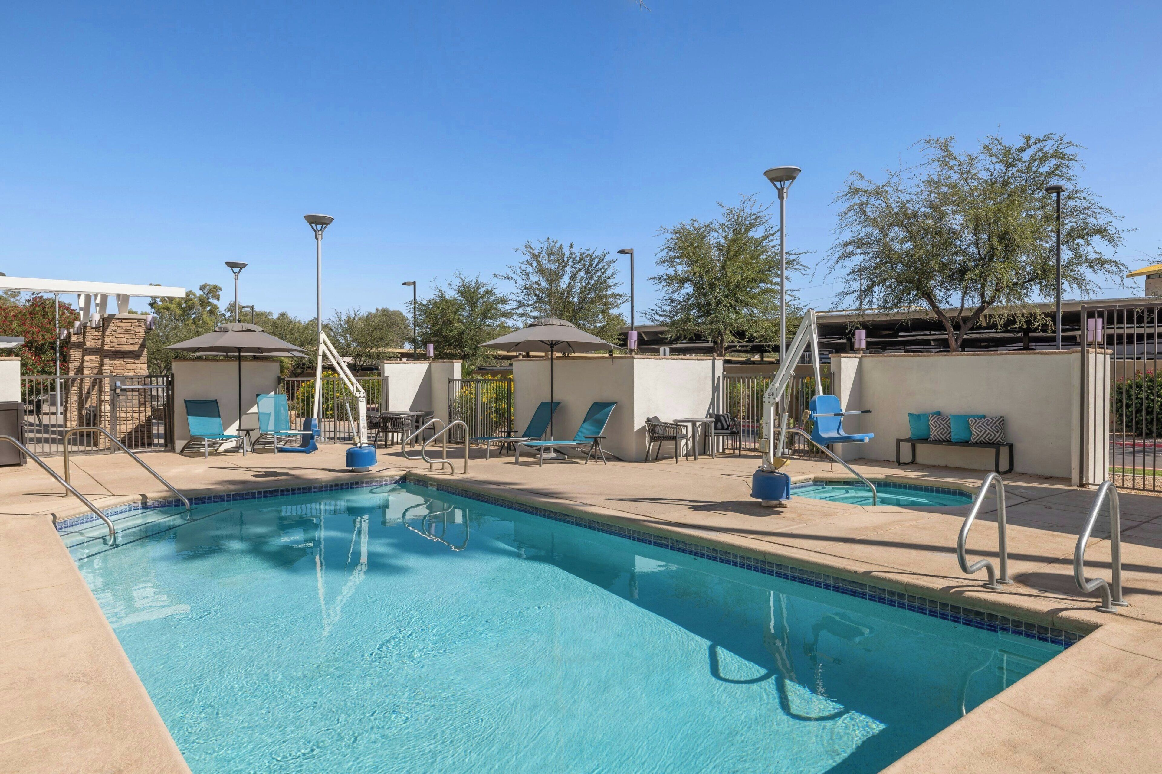 Outdoor pool, open 6:00 AM to 10:00 PM, pool umbrellas, pool loungers