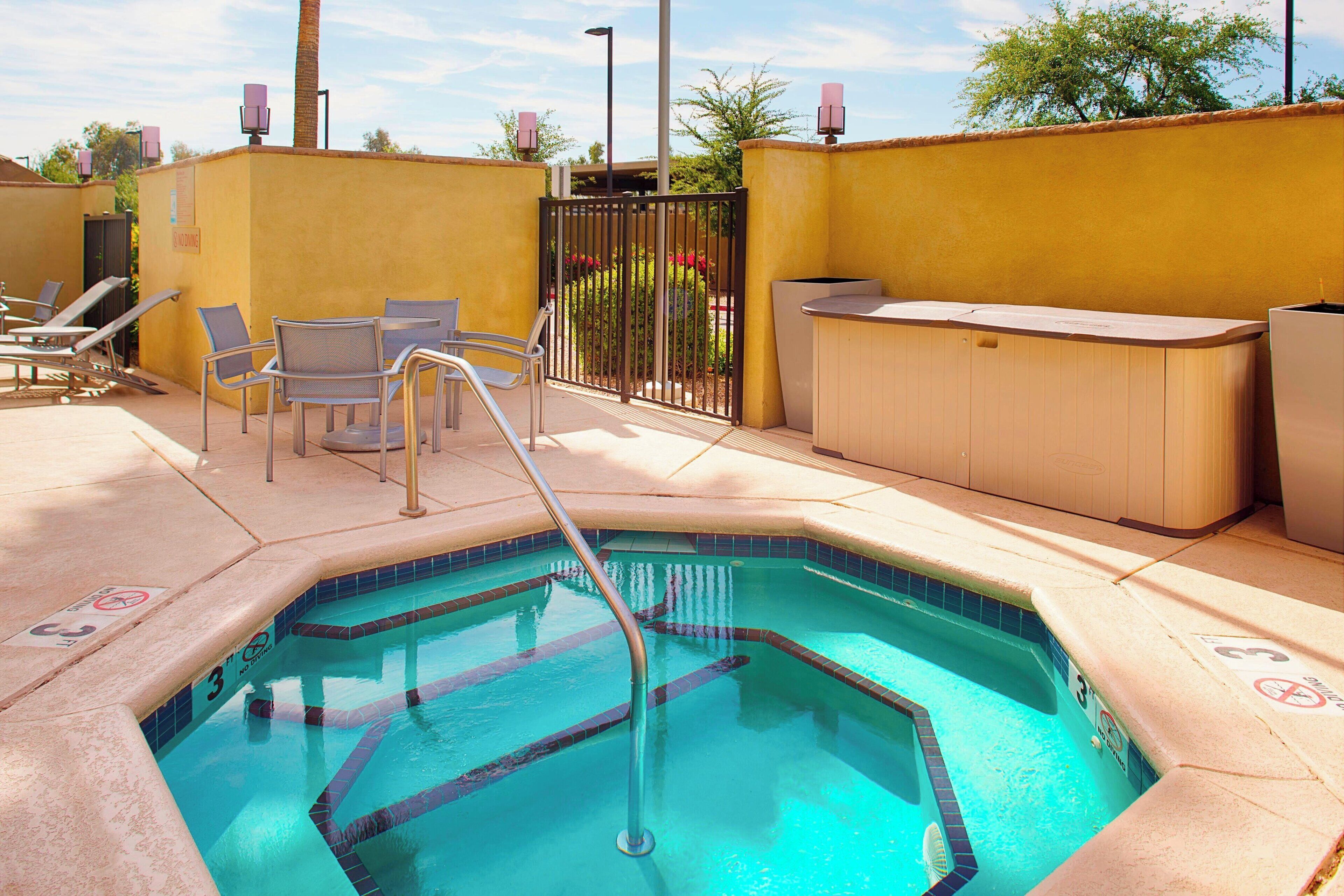 outdoor pool, open 6:00 am to 10:00 pm, pool umbrellas, pool loungers