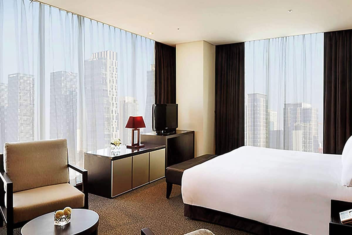 Luxe beddengoed, een minibar met enkele gratis items