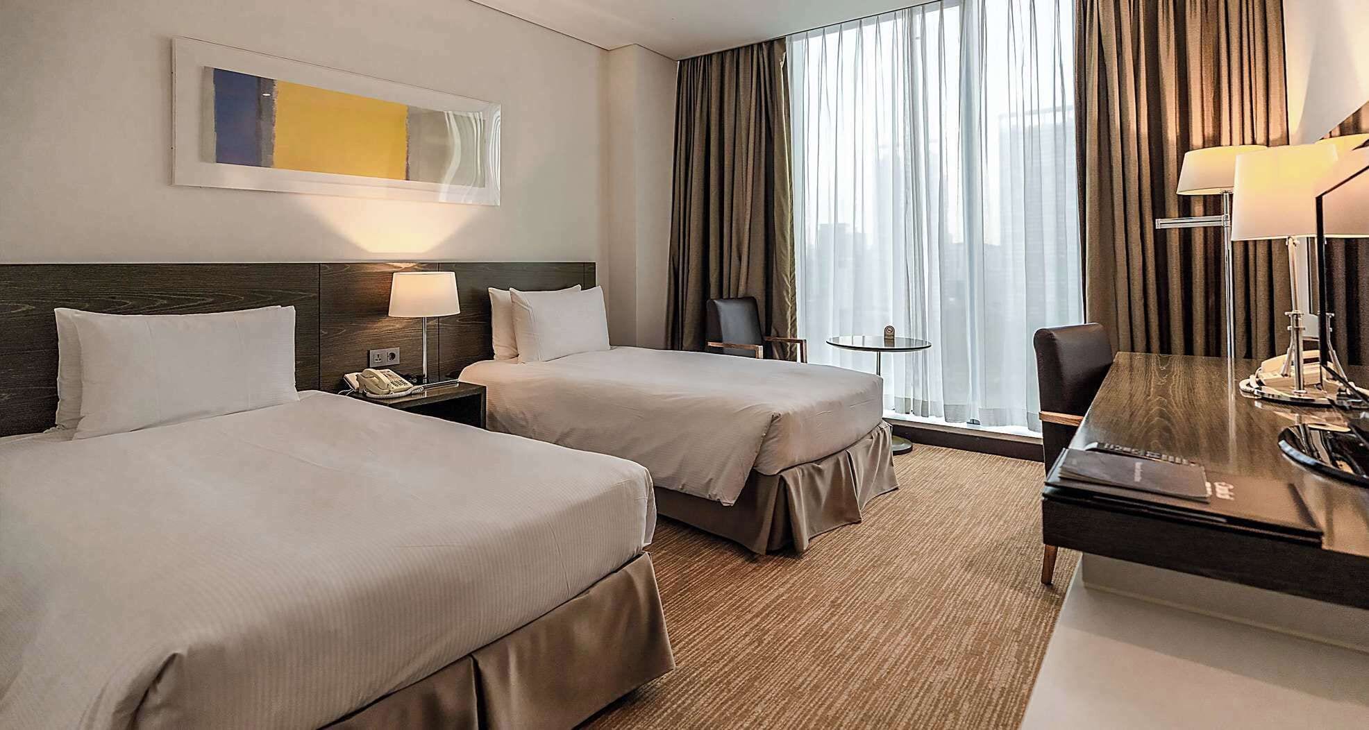 Premium bedding, free minibar items, in-room safe, desk