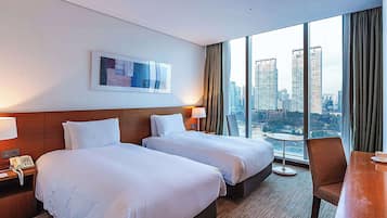 Premium bedding, free minibar items, in-room safe, desk