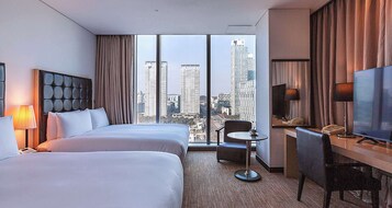 Premium bedding, free minibar items, in-room safe, desk