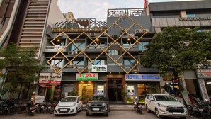 A hotel with a modern facade, multiple balconies, and a sign for 'Treebo'. - Treebo Natraj - Jaipur (Jaipur)