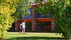 A two-story building with a stone facade and balconies. - Distinction Mackenzie Country Hotel (Twizel)