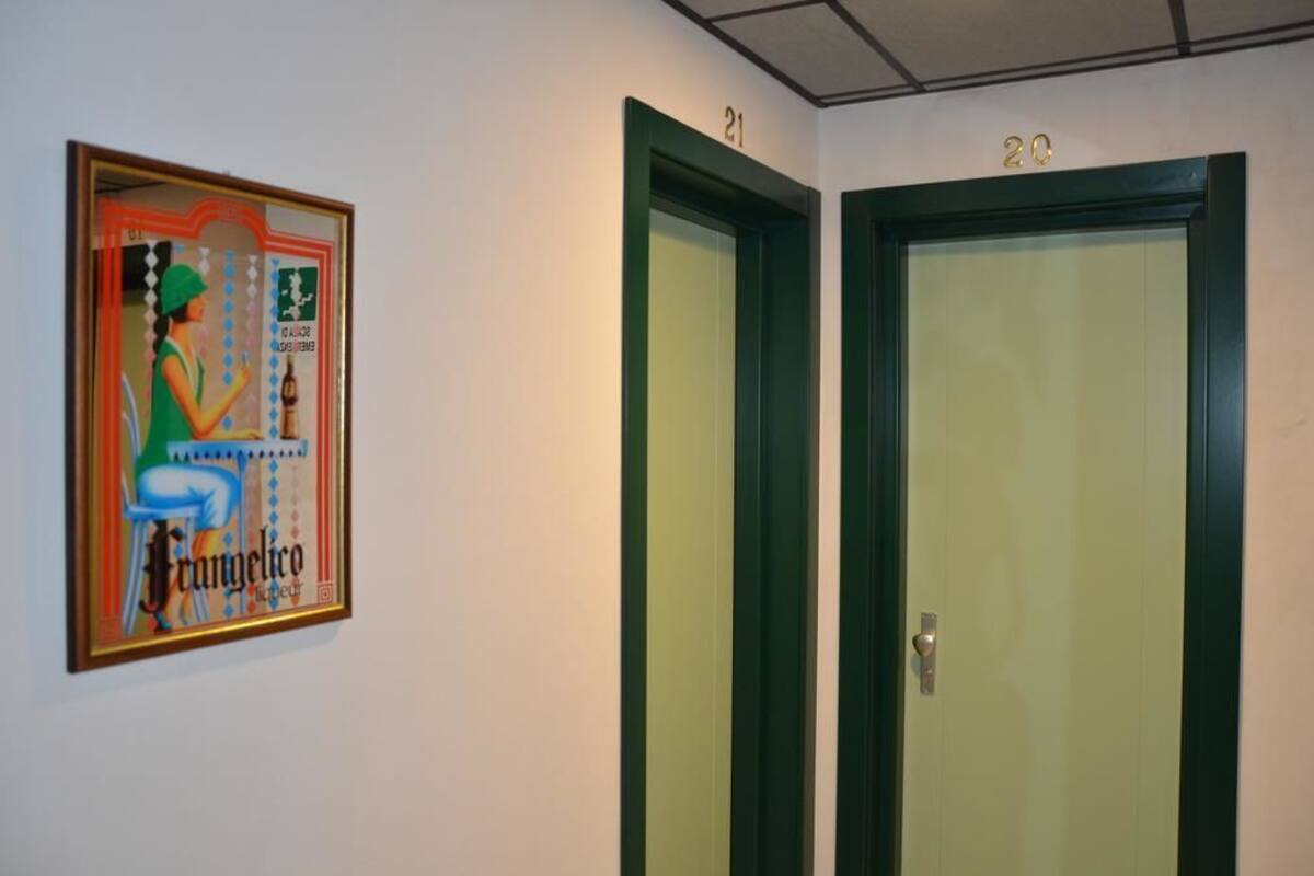 A hallway with two doors, each marked with a number.