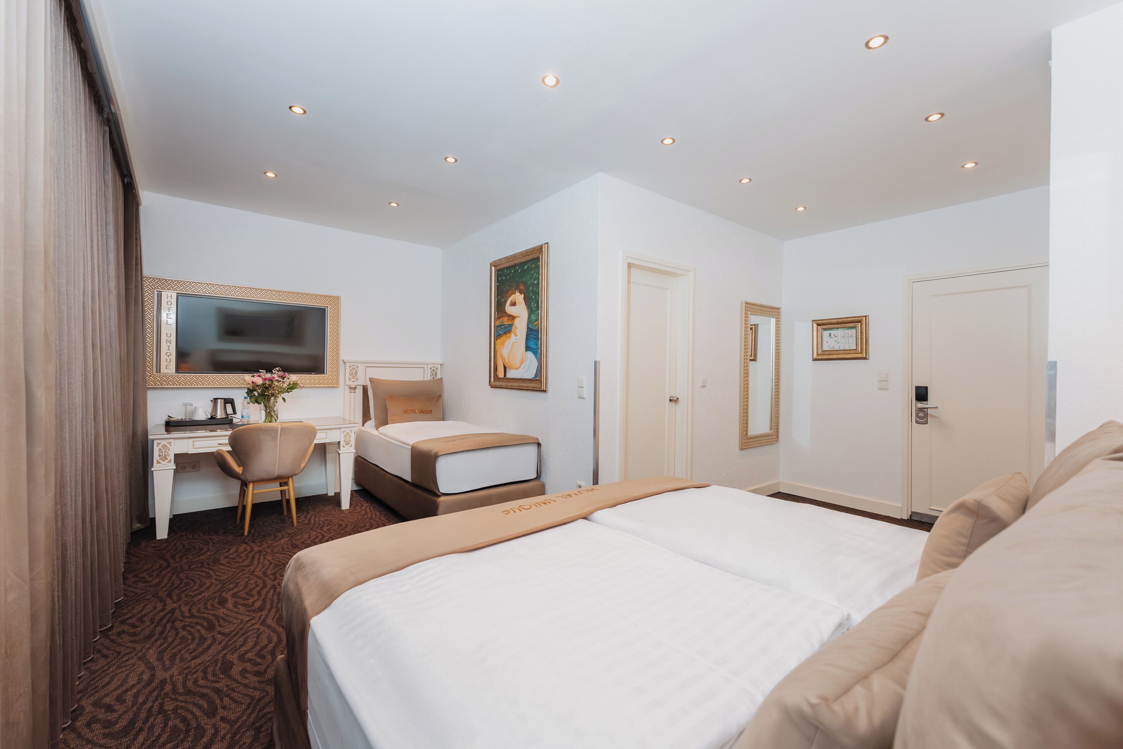 comfort triple room | premium bedding, in-room safe, individually decorated, desk