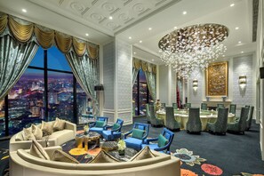 A luxurious hotel room with a city view, a chandelier, and a dining area. - InterContinental Shanghai Jing’ An by IHG (Shanghai)