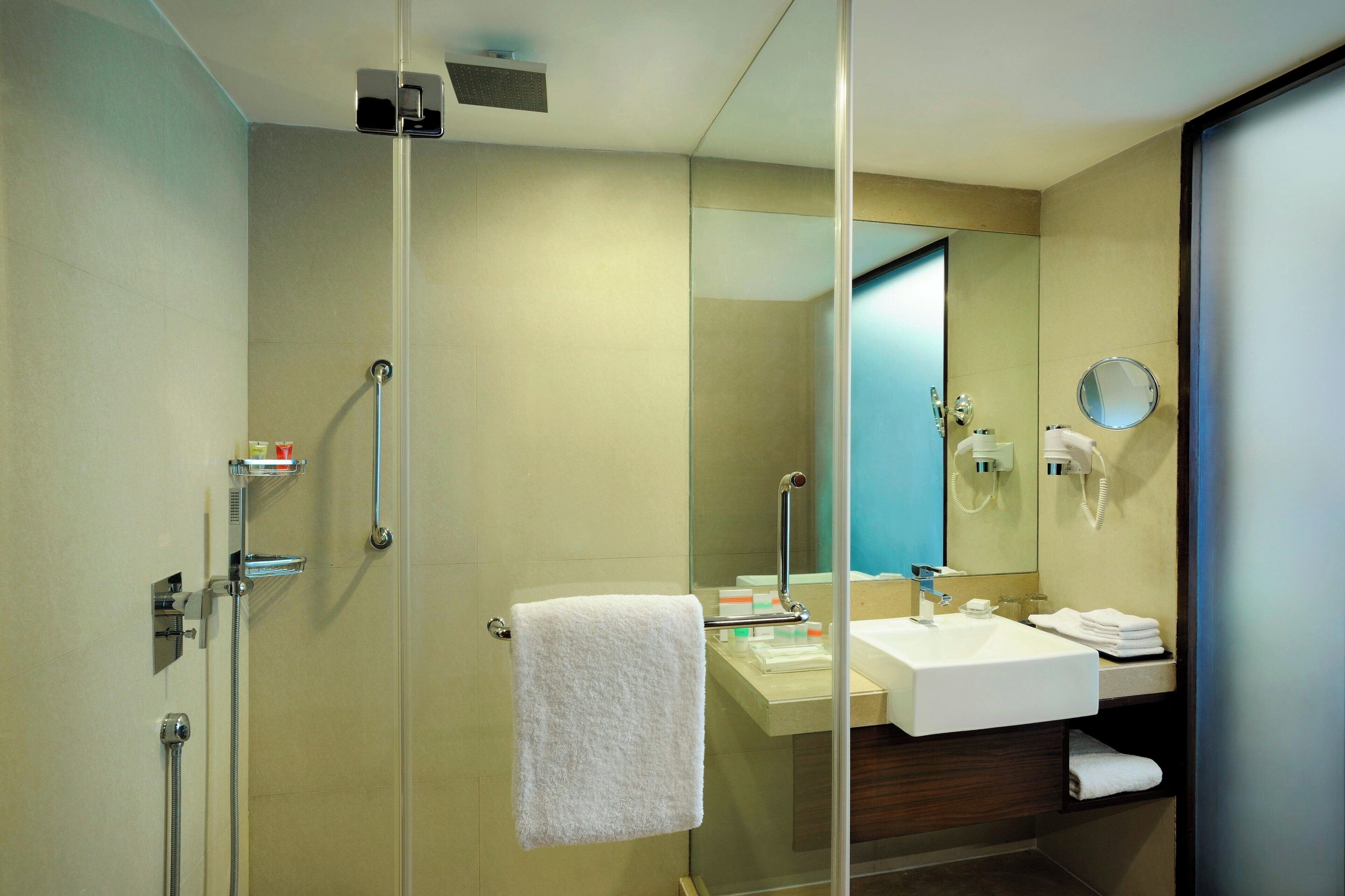 suite, 1 king bed | bathroom | shower, rainfall showerhead, free toiletries, hair dryer