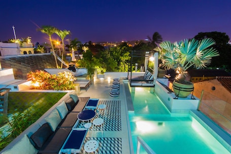 2 outdoor pools, open 8:00 AM to 7:00 PM, pool umbrellas, sun loungers