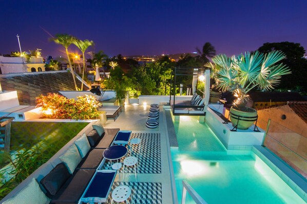 2 outdoor pools, open 8:00 AM to 7:00 PM, pool umbrellas, pool loungers