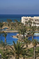 Indoor pool, outdoor pool, pool umbrellas, sun loungers