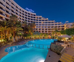 A hotel with a large pool, palm trees, and a sign reading "Shady Beach". - Seaside Sandy Beach (San Bartolomé de Tirajana)