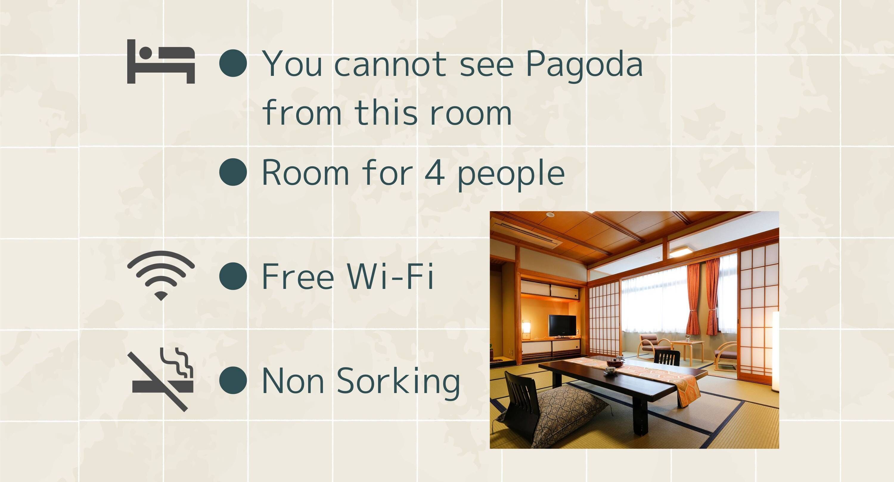 A traditional Japanese room with tatami flooring, a low table, and sliding doors.