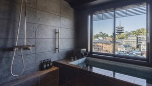 A modern bathroom with a large window, a shower, and a sink. - Asukasou (Nara)