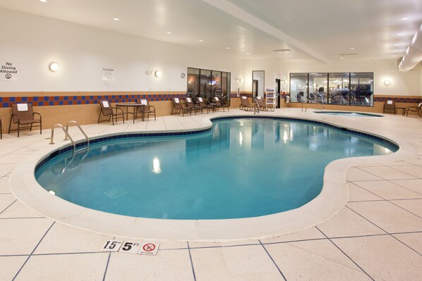 Indoor pool, open 7 AM to 11 PM, pool loungers