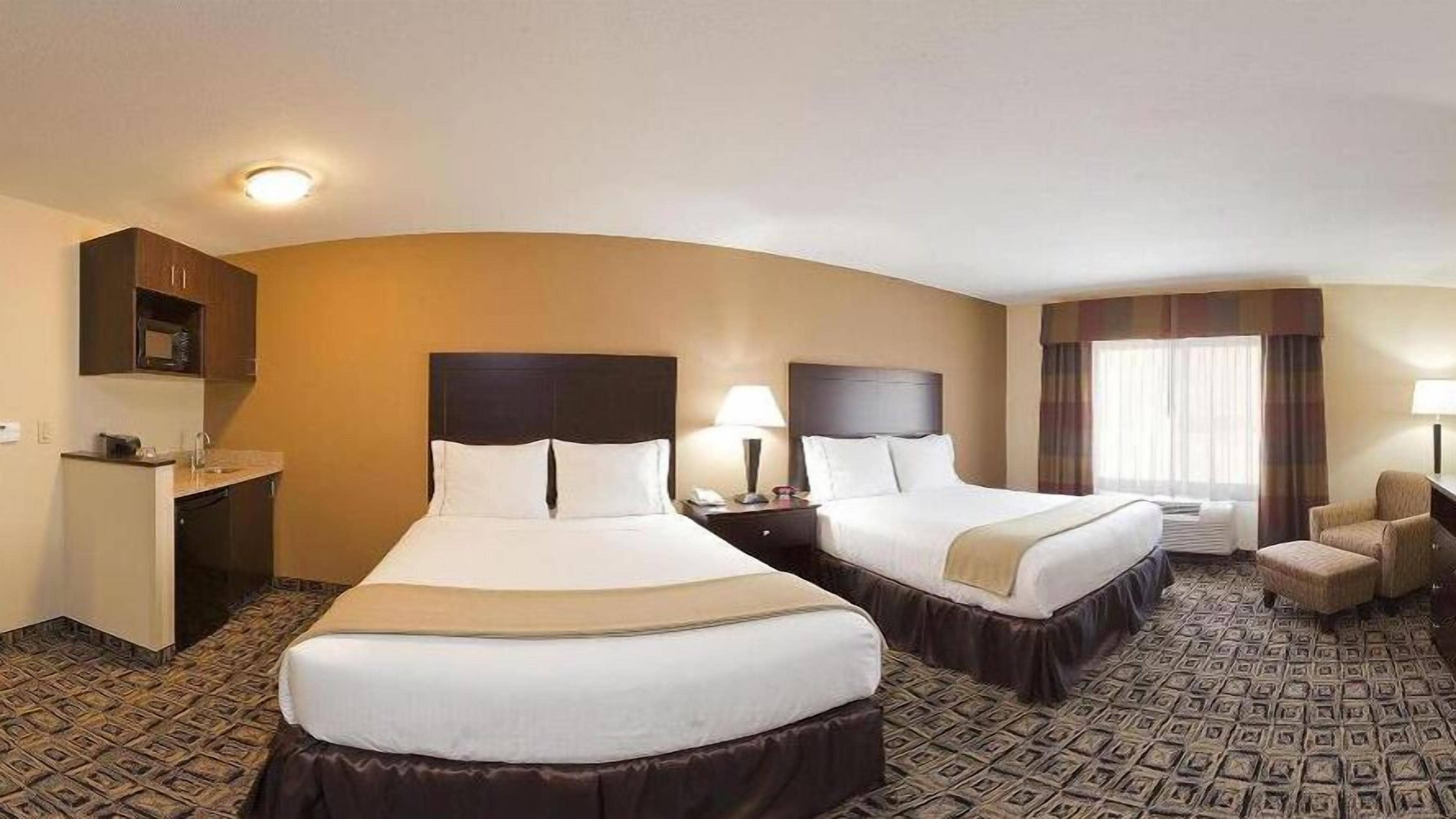 suite, 2 queen beds | in-room safe, individually furnished, desk, iron/ironing board