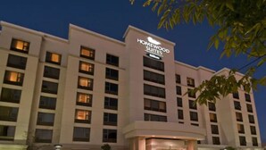 A multi-story hotel with a prominent sign reading "Homewood Suites." - Homewood Suites by Hilton Toronto Airport Corporate Centre (Toronto)