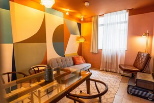 Habitación superior | Zona de estar