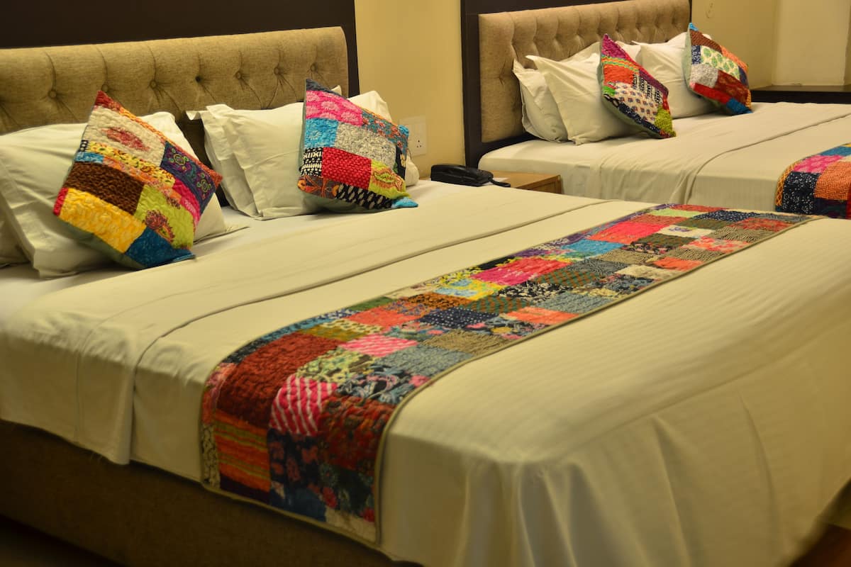 Family Room | Premium bedding, Select Comfort beds, desk, blackout drapes