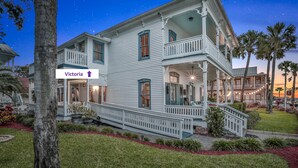 A two-story Victorian-style house with a balcony, a porch, and a staircase leading to the entrance. - Bayfront Westcott House St Augustine B&B (St. Augustine)