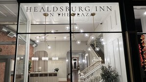A view of the Healdsburg Inn on the Plaza, featuring a modern interior with a staircase, seating area, and decorative lighting. - Healdsburg Inn on the Plaza, A Four Sisters Inn (Healdsburg)