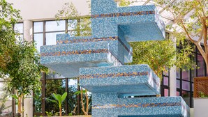A modern building with a unique blue-tiled staircase design. - Muthu Oura Praia Hotel (Albufeira)