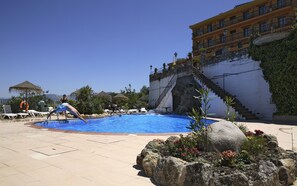 Outdoor pool, open 10:00 AM to 9:00 PM, pool loungers