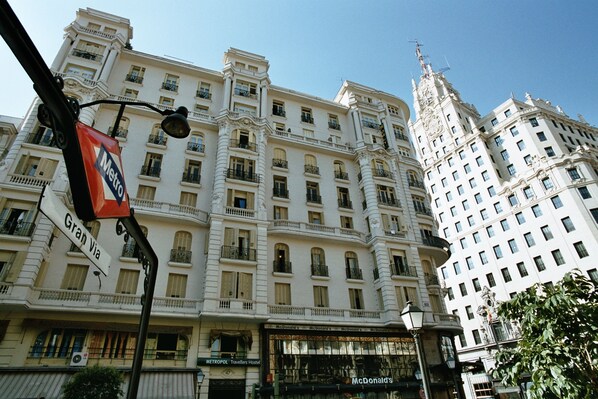 A large, ornate hotel with multiple balconies and a McDonald's restaurant on the ground floor. - Hostal Luis XV (Madrid)