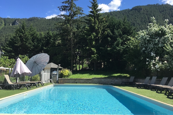 Seasonal outdoor pool, pool umbrellas, pool loungers