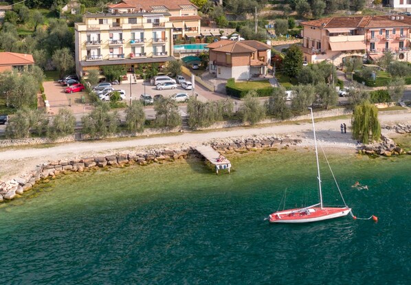 Enjoy stunning marina views from the comfort of your apartment, with a sailboat moored at the dock below.