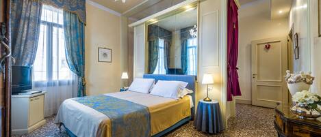 Premium bedding, down comforters, minibar, in-room safe