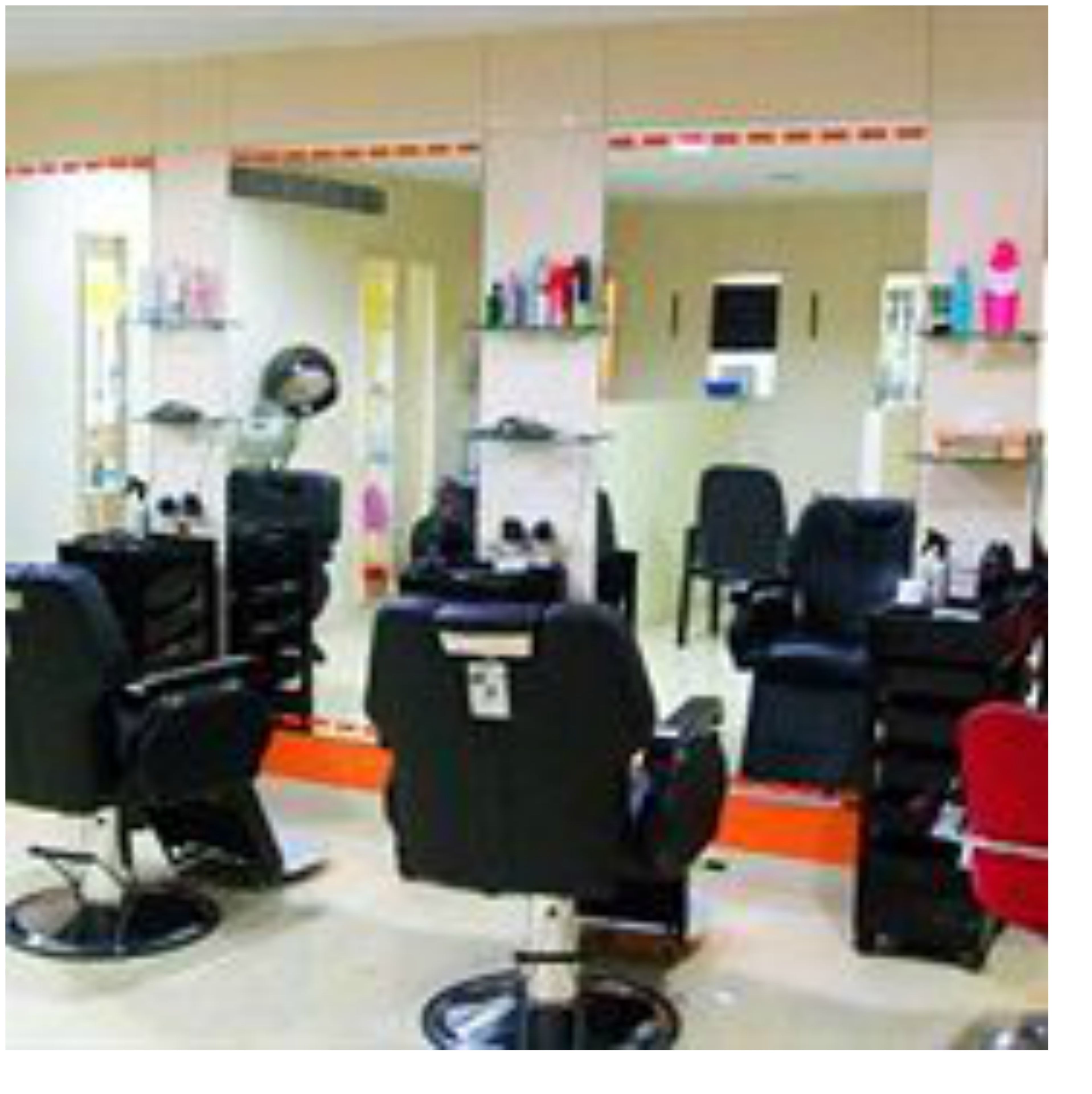 A salon with multiple hairdressing stations, each equipped with a chair, mirror, and various hairdressing tools.