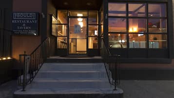 The entrance to the Goulden Restaurant & Tavern with a staircase leading up to the door.
