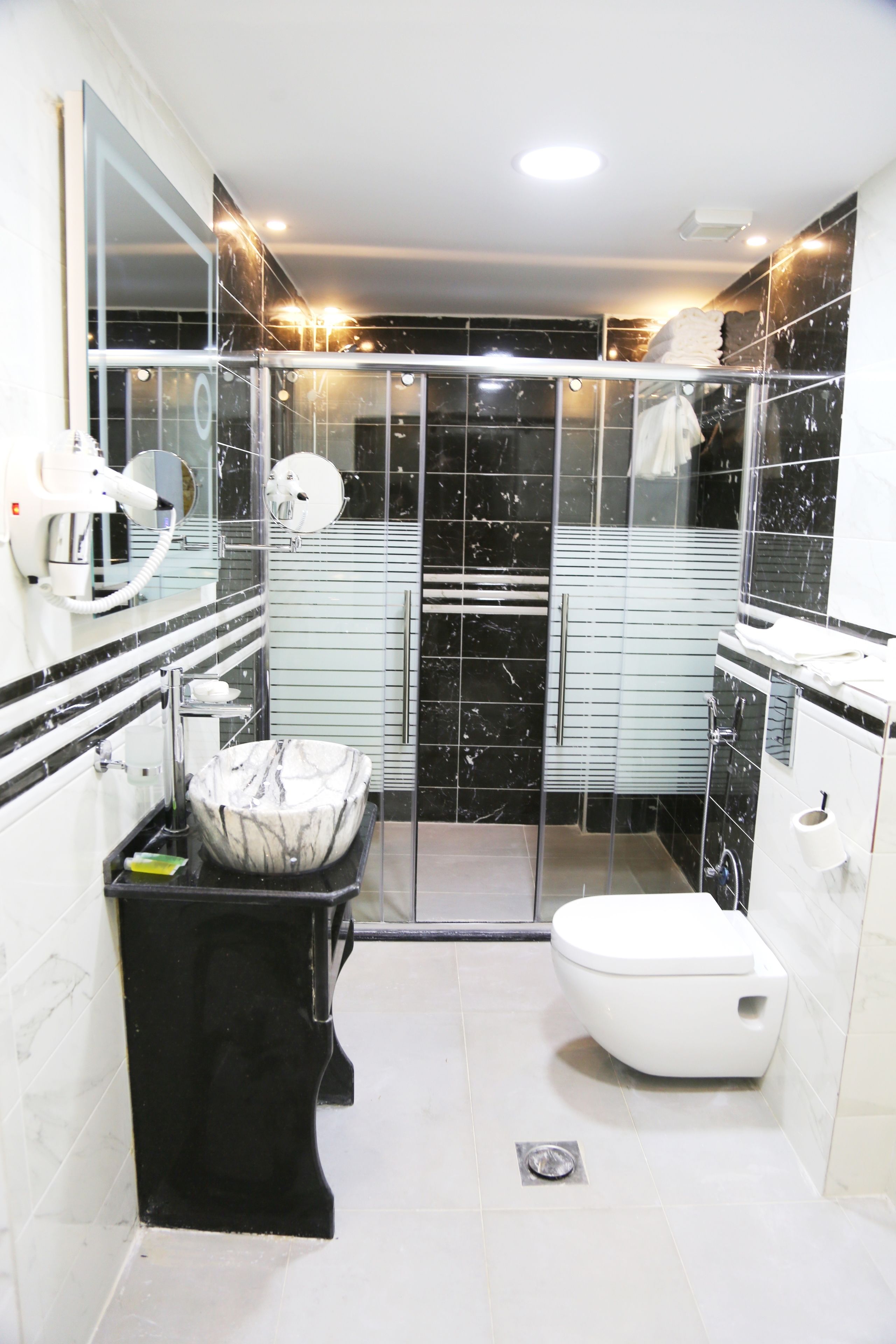 hydromassage showerhead, designer toiletries, hair dryer, bathrobes