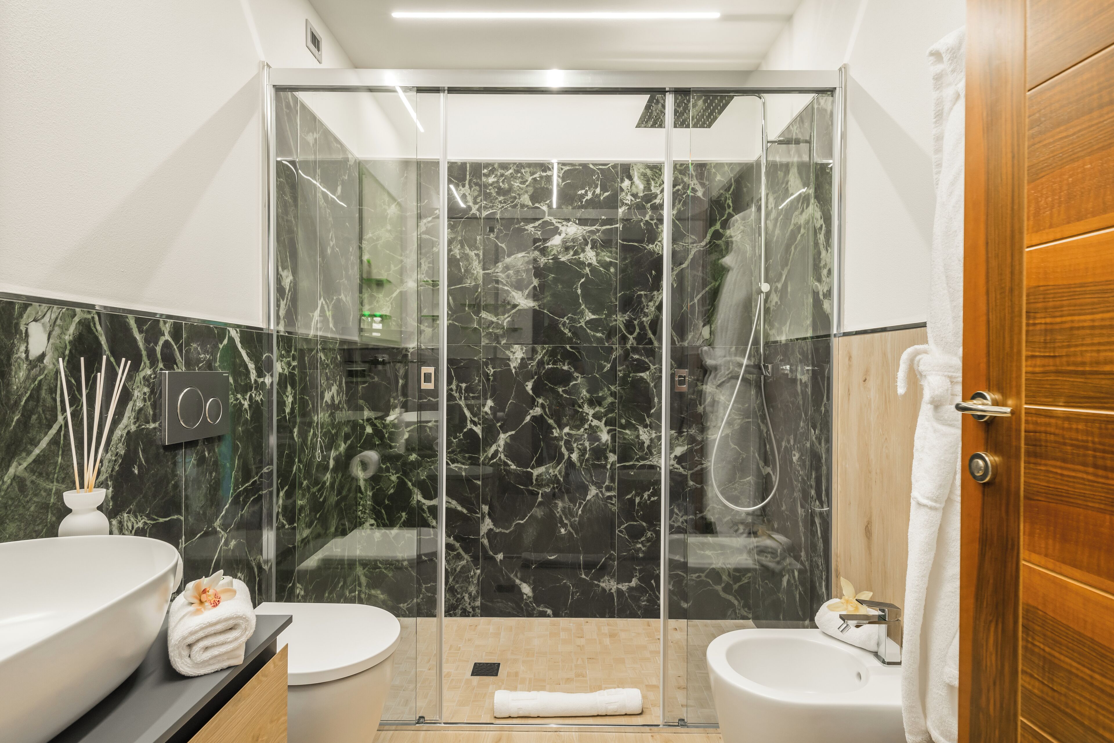 deluxe suite | bathroom | shower, rainfall showerhead, free toiletries, hair dryer