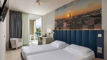 Down duvets, pillow-top beds, minibar, in-room safe