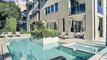 Seasonal outdoor pool, pool loungers