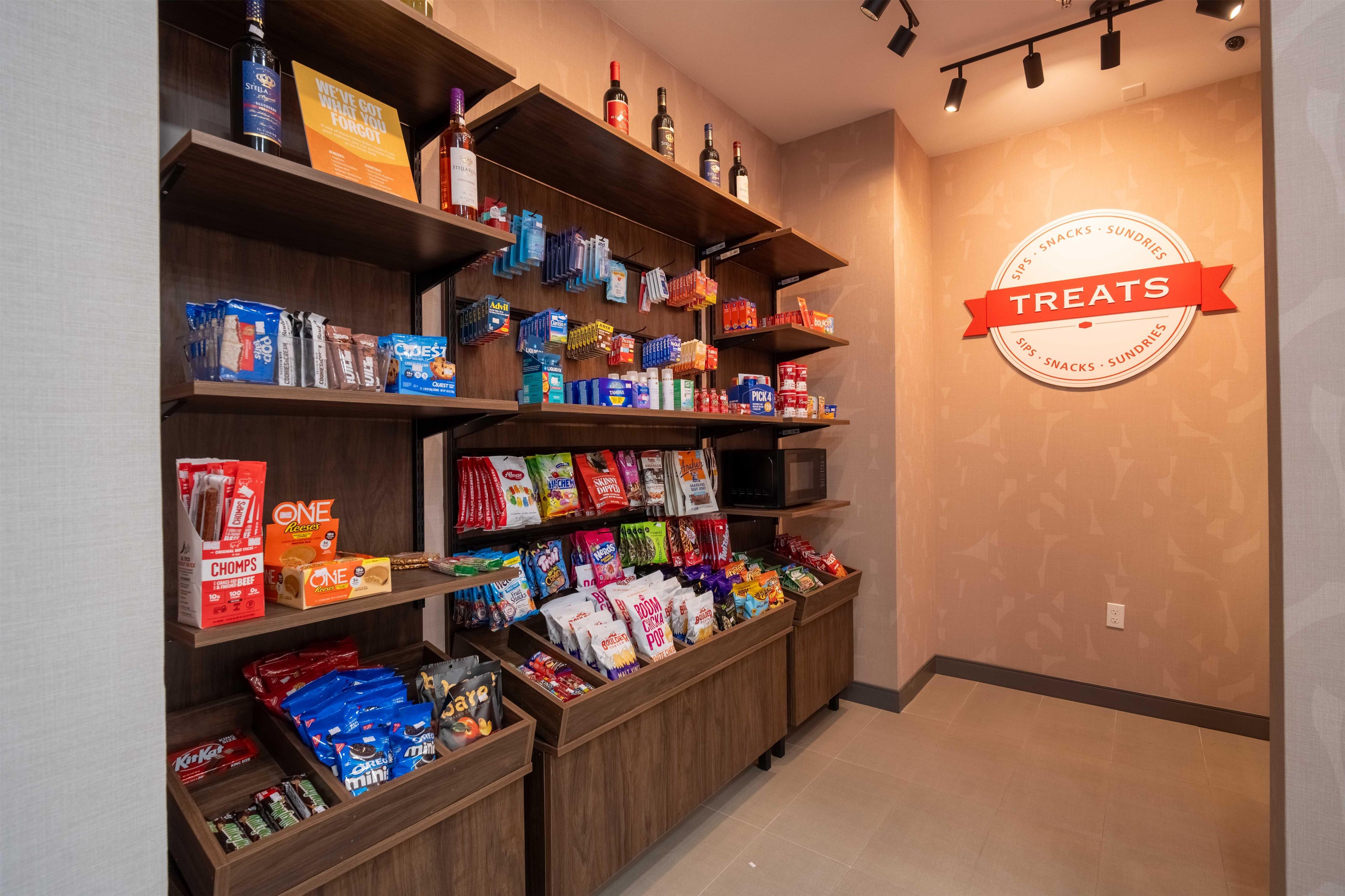 A snack and beverage display area with various products.