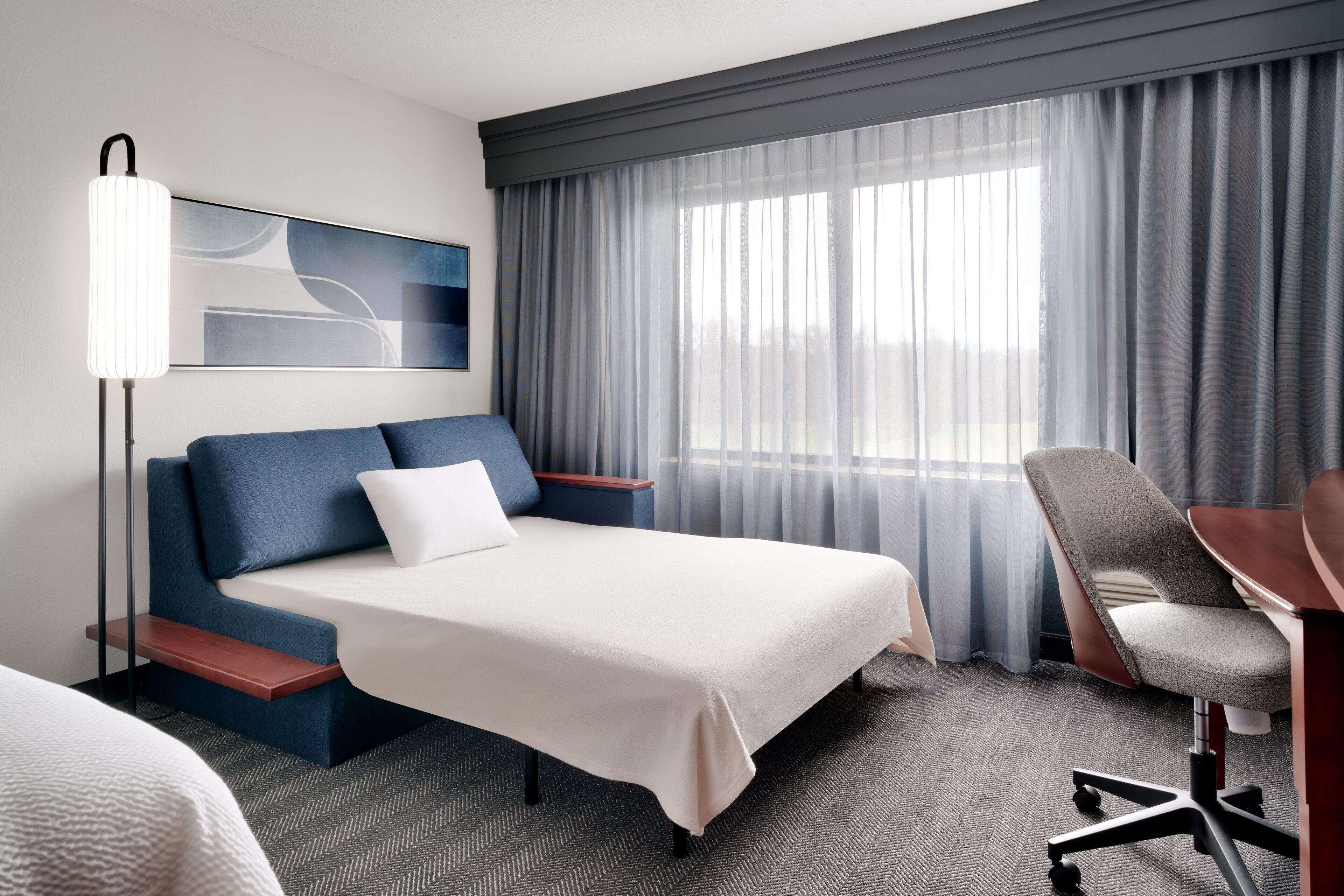 individually furnished, desk, laptop workspace, blackout curtains