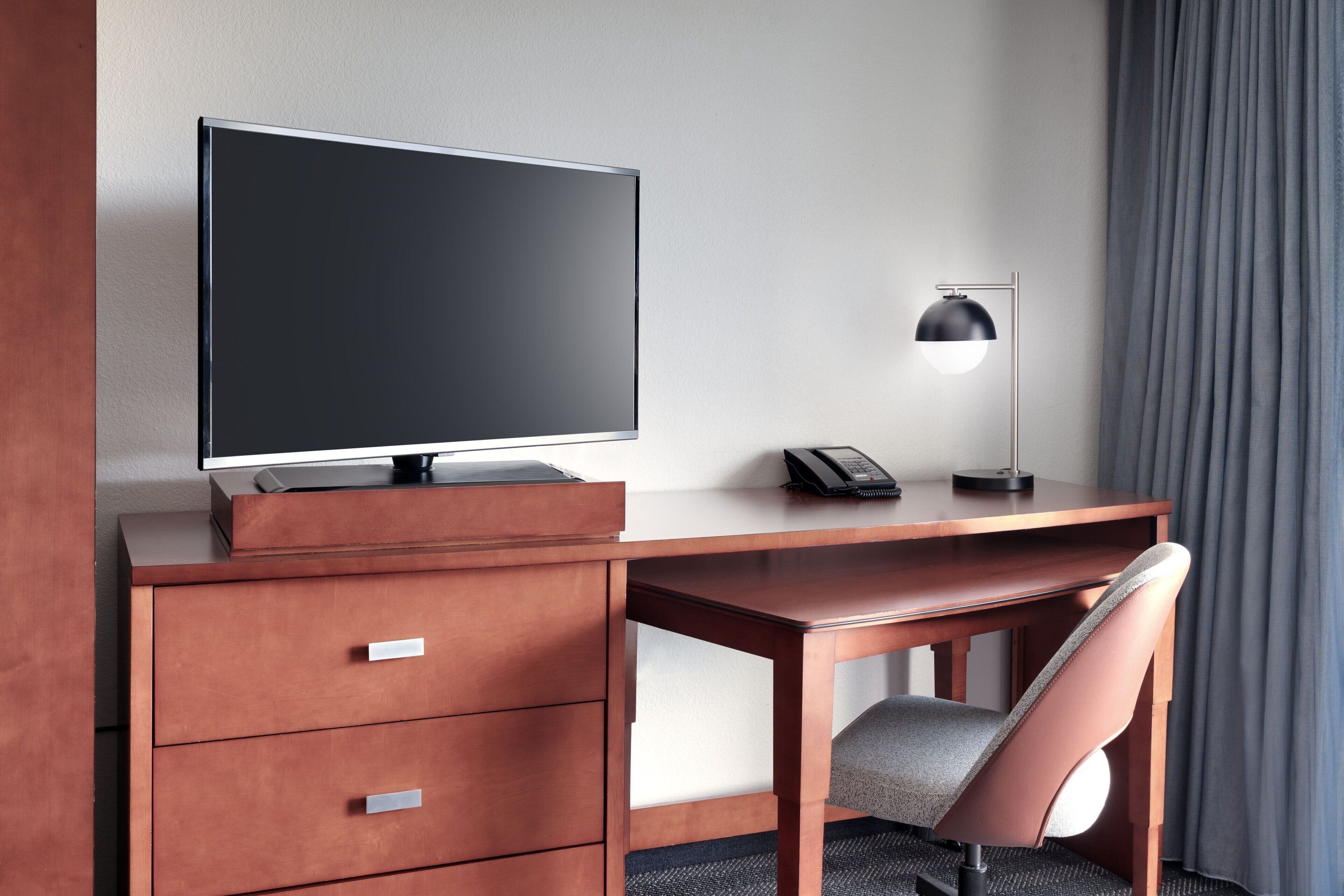 individually furnished, desk, laptop workspace, blackout curtains